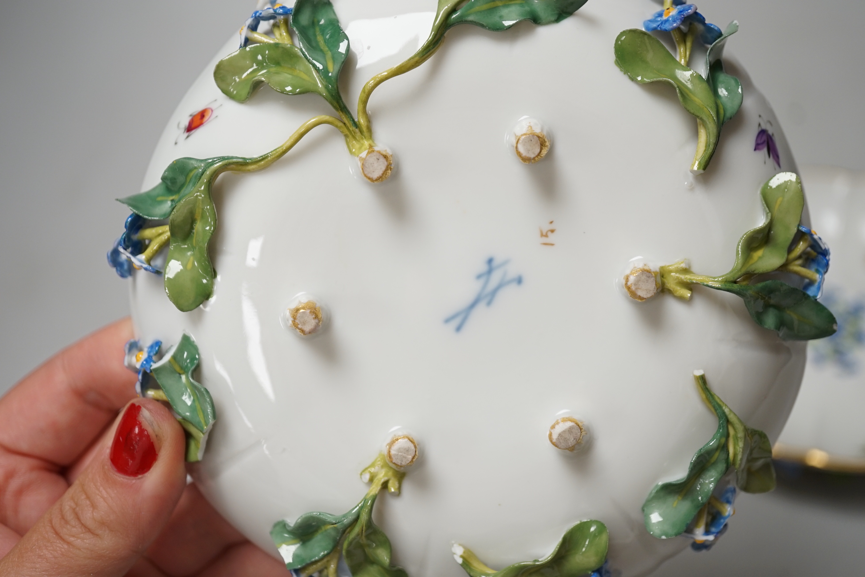 A pair of Meissen floral-encrusted cabinet cups and saucers, late 19th century, saucers 14cm diam.